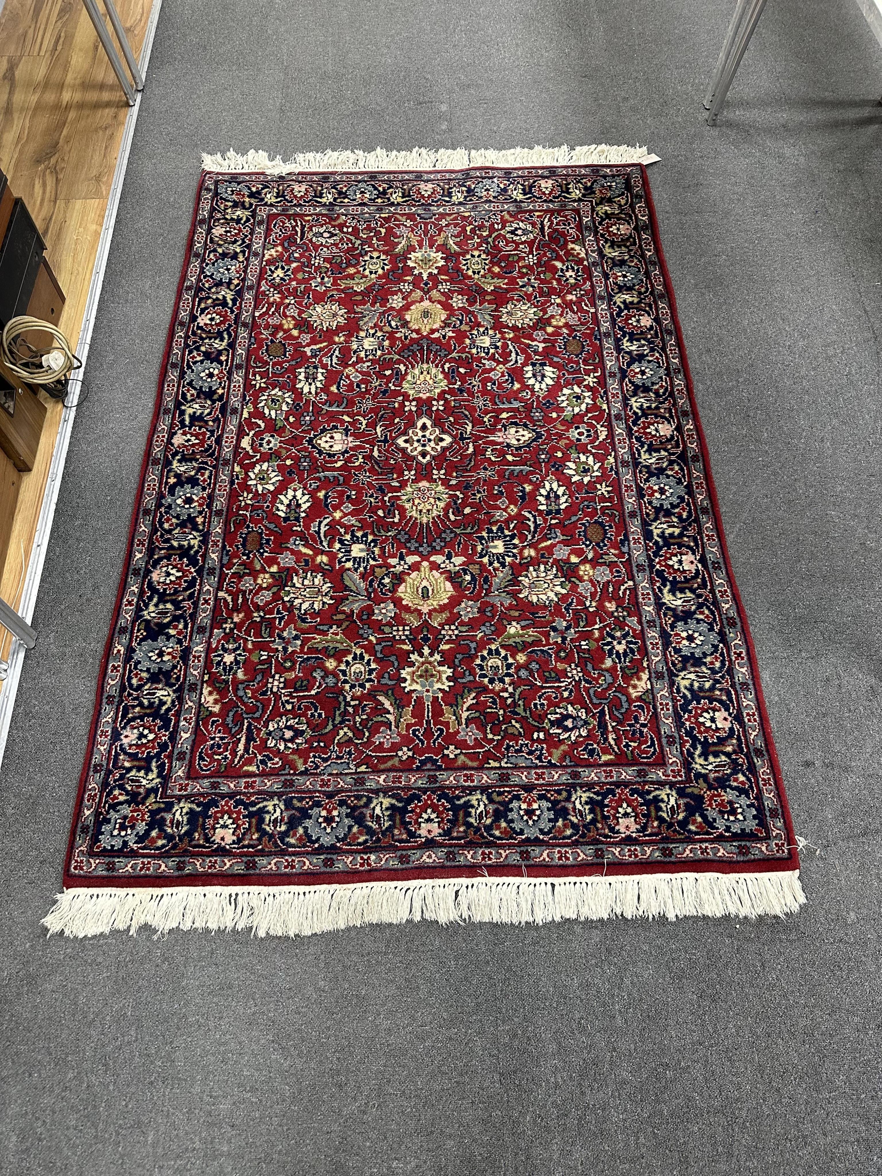 A North West Persian red ground rug, 190cm x 124cm. Condition - good.